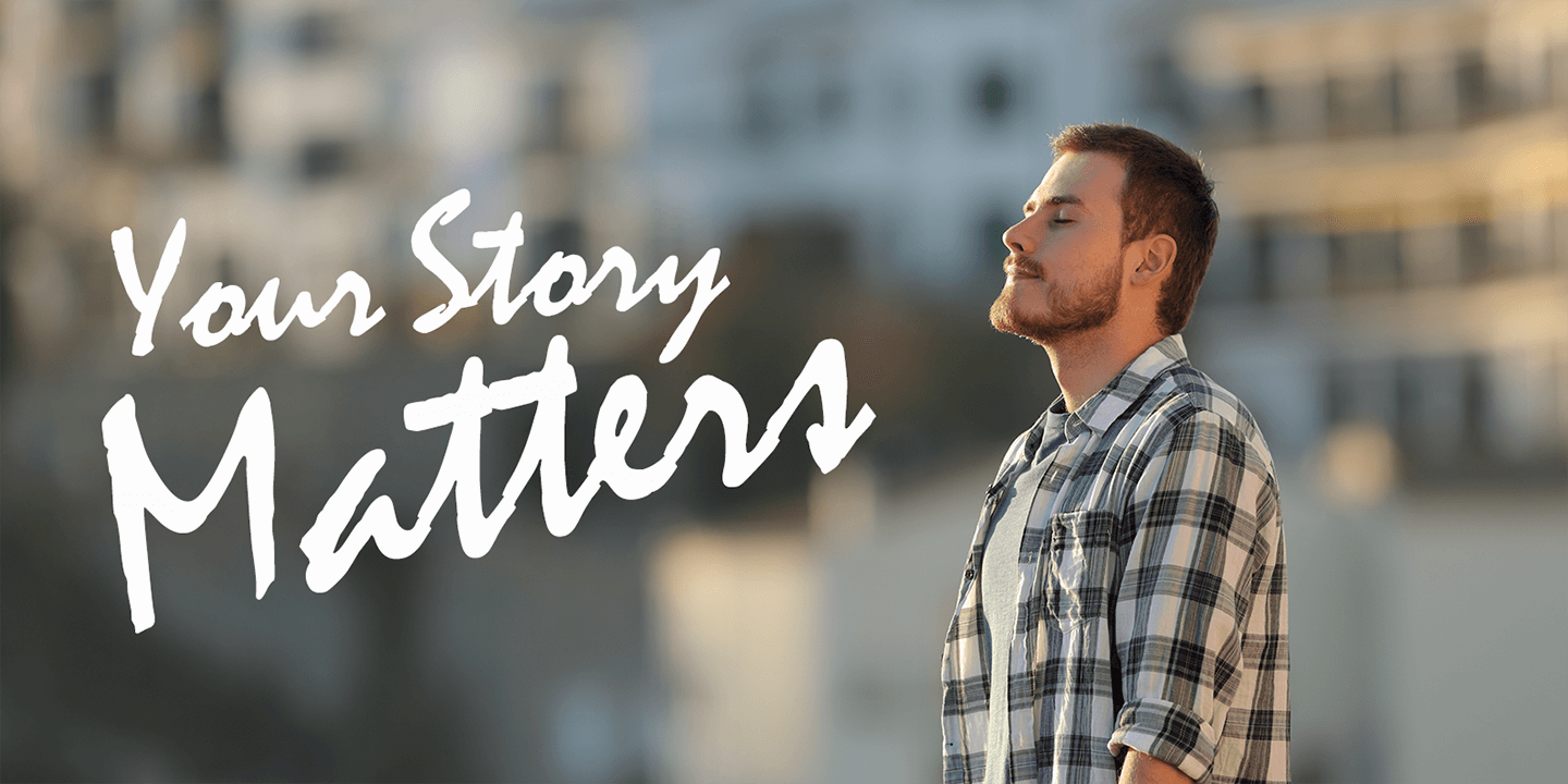 Man standing in the sunset light with his eyes closed with the text Share your story overlayed.